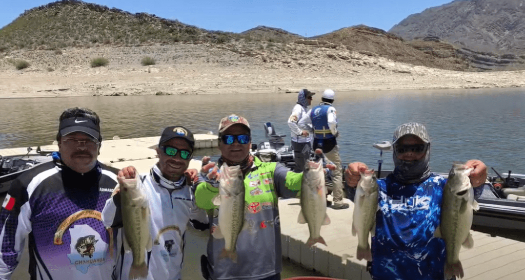 fishing team showin off all of their bass catches